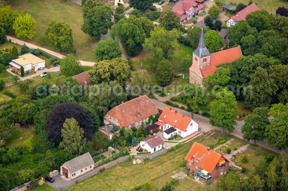 Aerial photograph Vipperow - Church building of gray stone church with the old town hall on the village road in Vipperow in Mecklenburg-Vorpommern