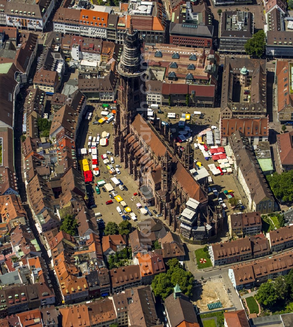 Freiburg im Breisgau from above - Church building of the Freiburg Muenster Cathedral Square in the old town of Freiburg in Baden-Wuerttemberg. freiburgermuenster.info