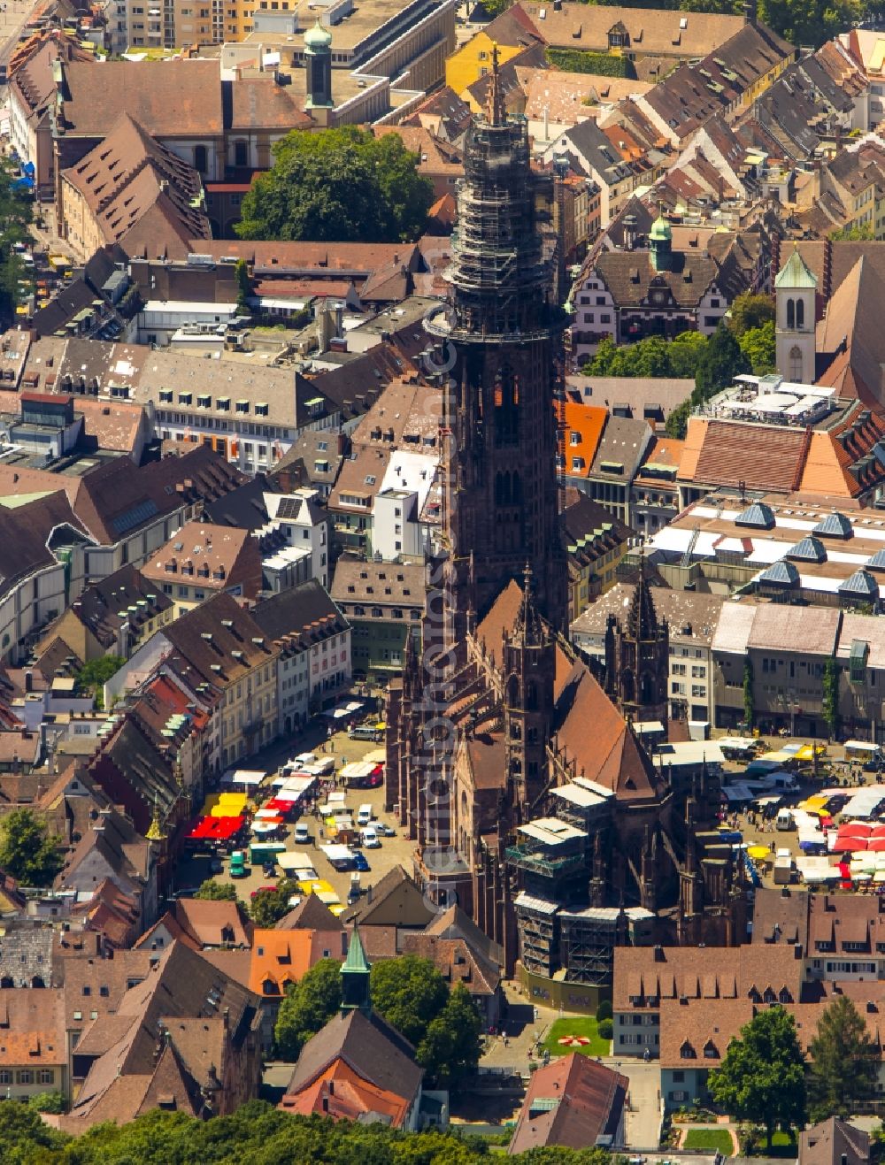 Freiburg im Breisgau from above - Church building of the Freiburg Muenster Cathedral Square in the old town of Freiburg in Baden-Wuerttemberg. freiburgermuenster.info