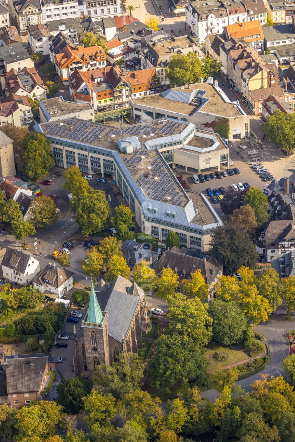 Menden (Sauerland) from the bird's eye view: Church building of the Heilig-Geist-Kirche at the industrial area along the course of the river Henne on the streets Untere Promenade and Bodelschwinghstrasse in Menden (Sauerland) in the state North Rhine-Westphalia, Germany