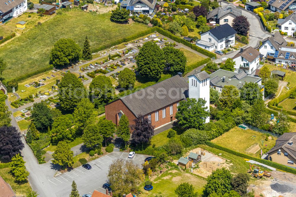 Langenholthausen from the bird's eye view: Church building St. Johannes Baptist on street Sunderner Strasse in Langenholthausen in the state North Rhine-Westphalia, Germany