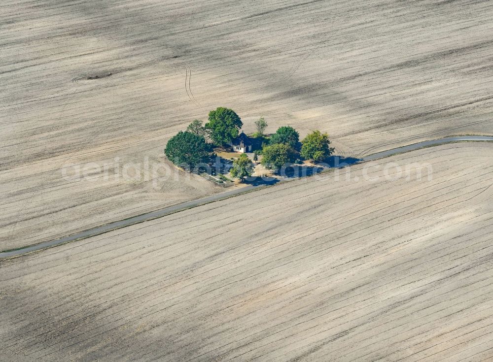 Aerial photograph Radensdorf - Churches building the chapel in plowed field landscape in Radensdorf in the state Brandenburg, Germany