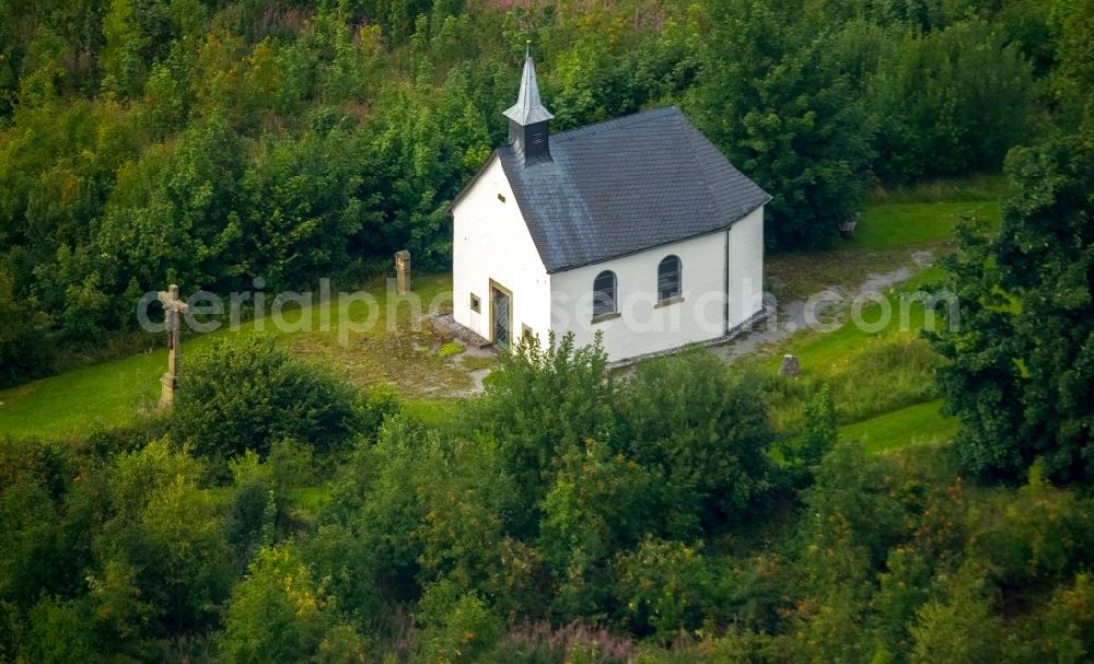 Warstein from above - Churches building the chapel Stillenberg in the Suttrop part of Warstein in the state of North Rhine-Westphalia. The white chapel is located on the hill of the wooded Stillenberg mountain