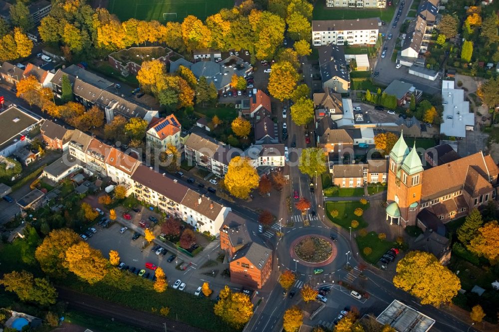 Gladbeck from above - Church building of the Herz Jesu church community on Kardinal-Hengsbach Square in autumnal Gladbeck in the state of North Rhine-Westphalia