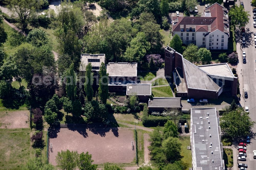 Berlin from above - Church building of the catholic community Zum Guten Hirten in a residential area on Kurze Strasse in the Friedrichsfelde part of the district of Lichtenberg in Berlin, Germany