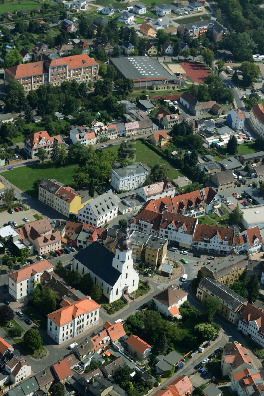 Taucha from the bird's eye view: Church building St. Moritz in the historic town- center of Taucha in the state of Saxony. The church with the white front is located on church square in the centre of the town