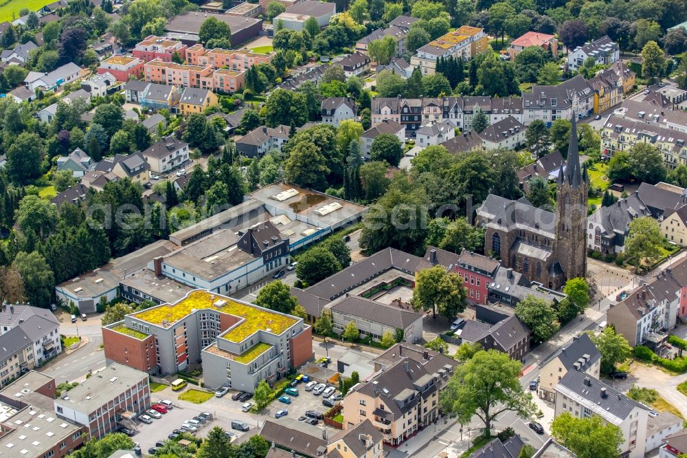 Heiligenhaus from above - Church building of Saint Suitbertus on Hauptstrasse in Heiligenhaus in the state of North Rhine-Westphalia. View of the town center between Hauptstrasse and Suedring