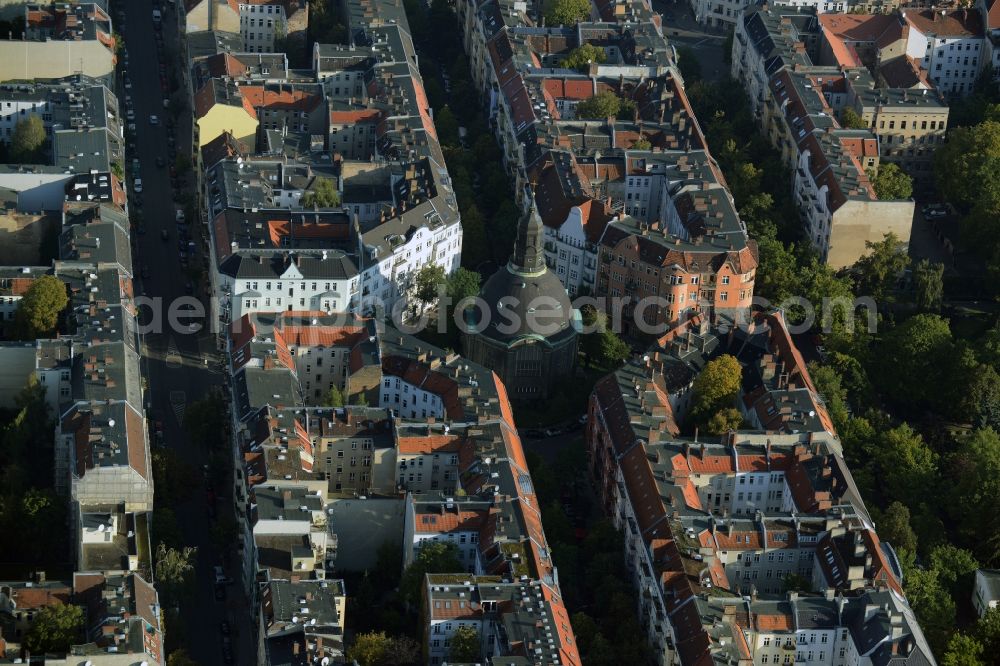 Berlin from the bird's eye view: Church building of Koenigin-Luise-Church on Gustav-Mueller Square in the Rote Insel part of the Schoeneberg part of Berlin in Germany. The church with its dome and small tower is located amidst residential buildings of the borough