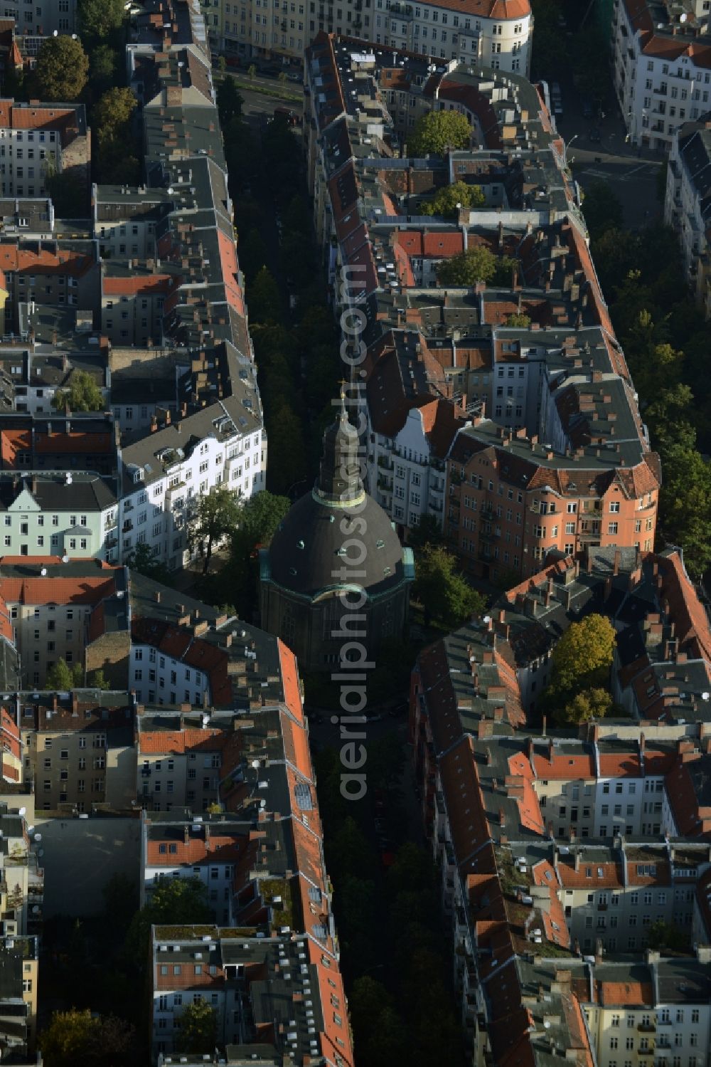 Aerial image Berlin - Church building of Koenigin-Luise-Church on Gustav-Mueller Square in the Rote Insel part of the Schoeneberg part of Berlin in Germany. The church with its dome and small tower is located amidst residential buildings of the borough