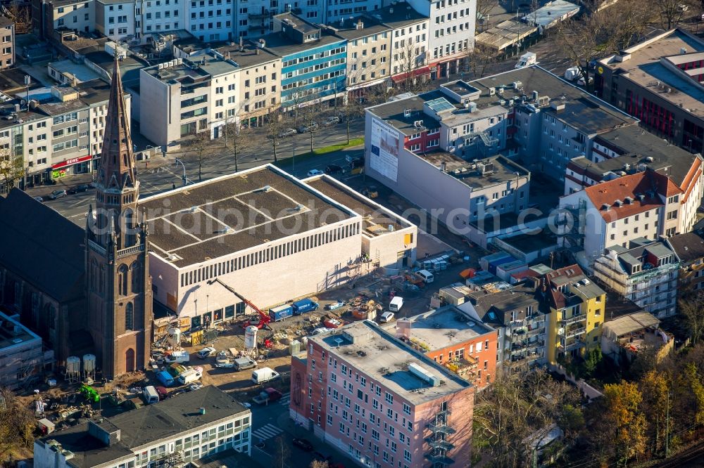 Bochum from the bird's eye view: Church building Marienkirche at the Marienplatz with the almost finished construction site of the Bochum Symphony in Bochum in the state North Rhine-Westphalia