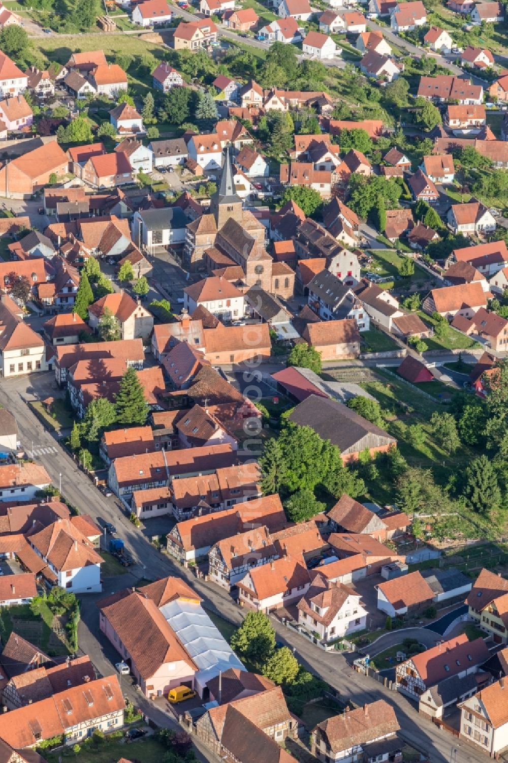 Aerial image Surbourg - Church building in of PresbytA?re Catholique Old Town- center of downtown in Surbourg in Grand Est, France