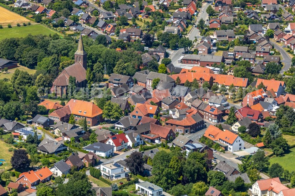 Aerial image Ostenfelde - Church building Sankt Margaretha parish church in the old town centre of the city centre in Ostenfelde in the federal state of North Rhine-Westphalia, Germany