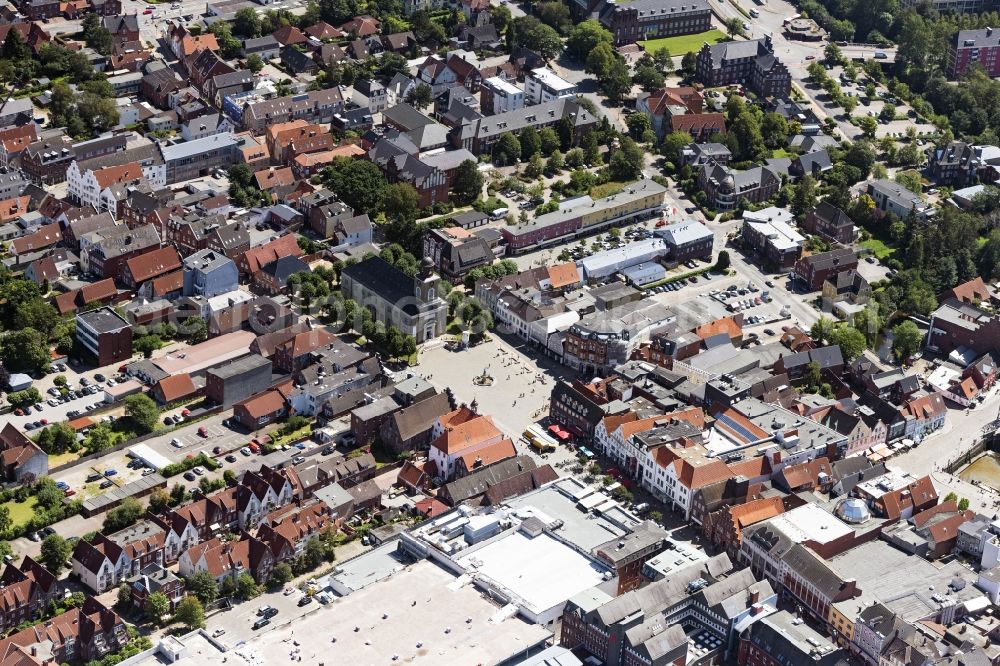 Aerial image Husum - Church building in of St.Marienkirche and das Asmussen-Woldsen-Denkmal on Markt Old Town- center of downtown in Husum in the state Schleswig-Holstein, Germany