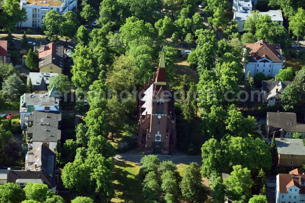 Berlin from the bird's eye view: Church tower and tower roof at the church building of Petruskirche in Berlin Lichterfelde, Germany