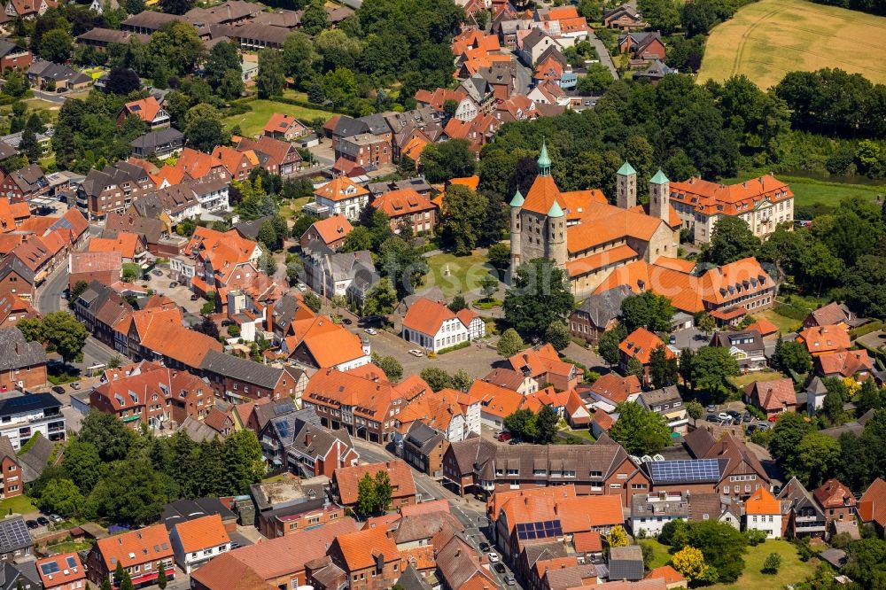 Freckenhorst from the bird's eye view: Church tower and tower roof at the church building of Schloss Freckenhorst on Stiftshof in Freckenhorst in the state North Rhine-Westphalia, Germany