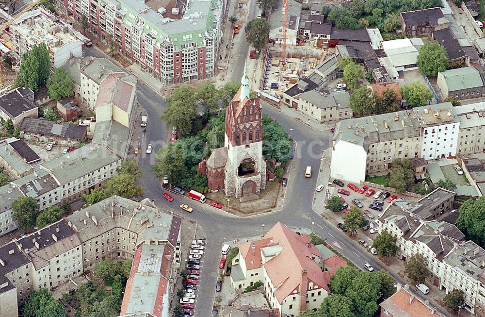 Aerial image Berlin - Church tower and tower roof at the church building of on Kreisverkehr of Mirbachplatz in the district Weissensee in Berlin, Germany