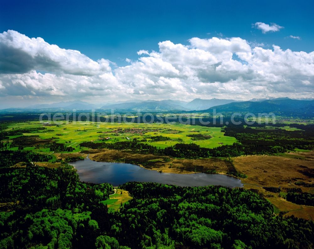 Sachsenkam from above - Lake Kirchsee in Sachsenkam in the state Bavaria, Germany. The moor lake with a maximum depth of 16m is located on the Northern edge of the nature preserve area Ellbach and Kirchsee moor