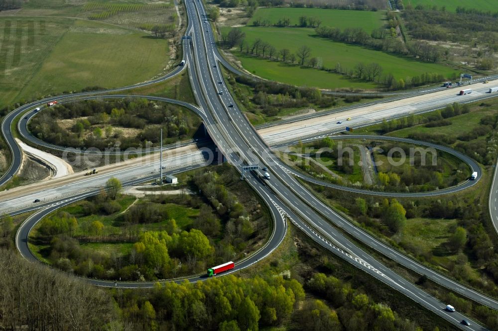 Aerial image Velten - Traffic flow at the intersection- motorway A10 Oranienburger Kreuz in form of cloverleaf in Velten in the state Brandenburg, Germany