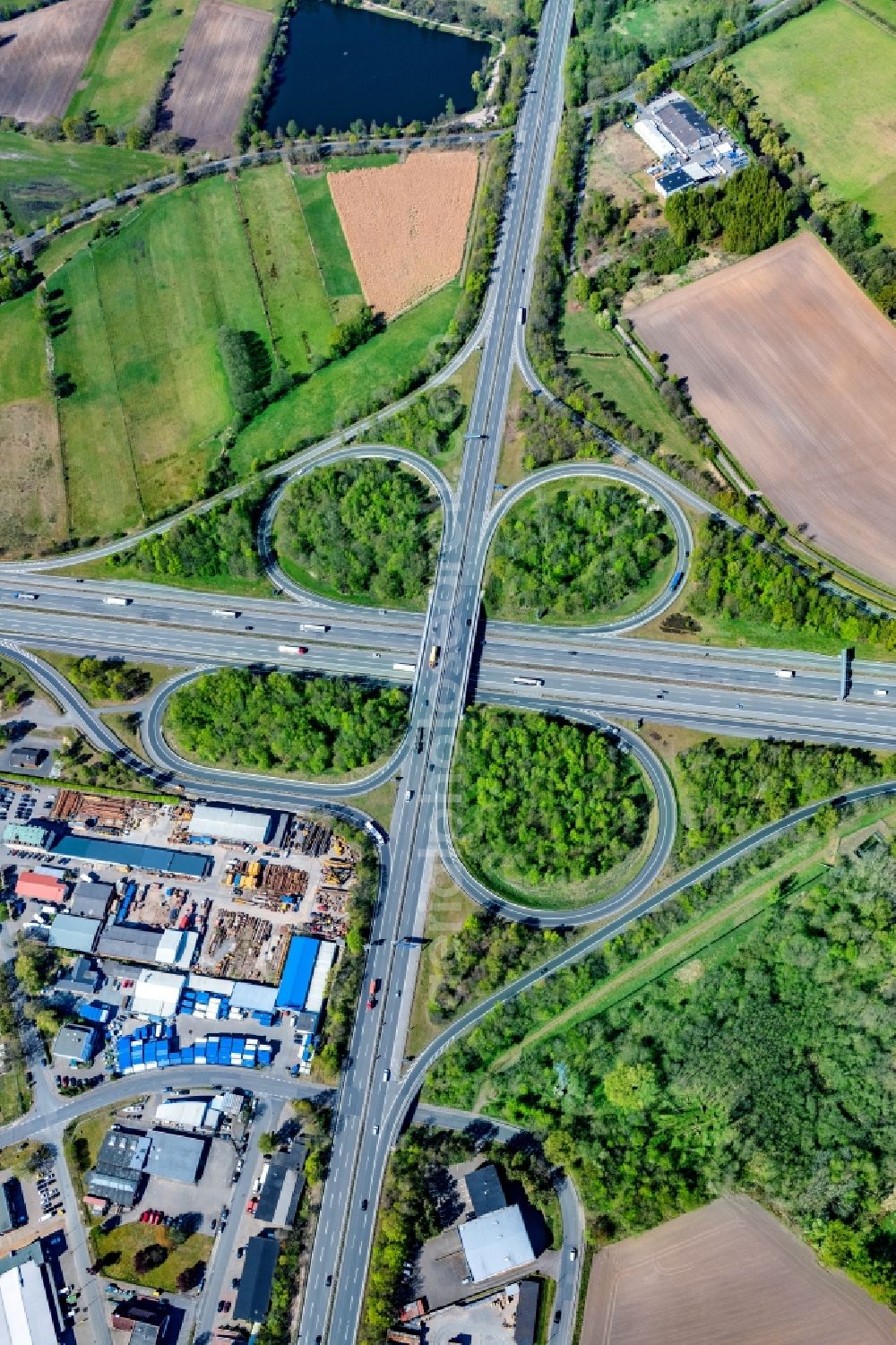 Seevetal from above - Traffic flow at the intersection- motorway A1 and A39 in form of cloverleaf in the district Karoxbostel in Seevetal in the state Lower Saxony, Germany