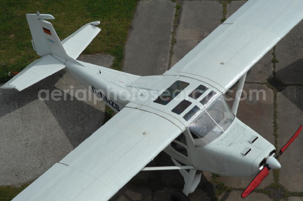 Aerial photograph Werneuchen - Blick auf Kleinflugzeuge auf dem brandenburgischen Flugplatz Werneuchen. Wo jahrzehntelang russische Jagdflugzeuge stationiert waren, haben heute kleine Maschinen ihr Domizil. Im Bild ein Ultraleichtflugzeug WT 01 D-MNZB der Luftbildagentur euroluftbild.de. Von hier aus startet das Unternehmen europaweite Luftbildbefliegungen.