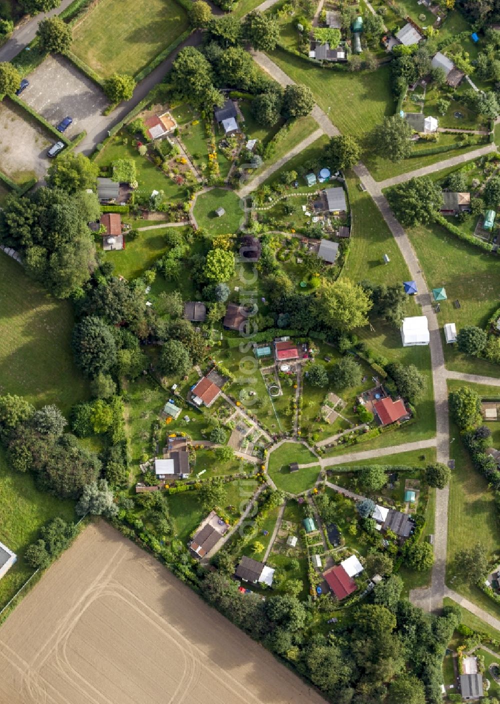 Aerial image Witten - Blick auf die Kleingartenanlage Am Heuweg in Witten im Bundesland Nordrhein-Westfalen NRW. Zu sehen sind in Rondellen angelegte Parzellen. Verantwortlich ist Kleingartnverein Am Heuweg e.V.// View at the garden allotment at Heuweg in Witten in the federal state North Rhine-Westphalia. To see are in roundels created parcels. Responsible is the Kleingartenverein Am Heuweg e.V.