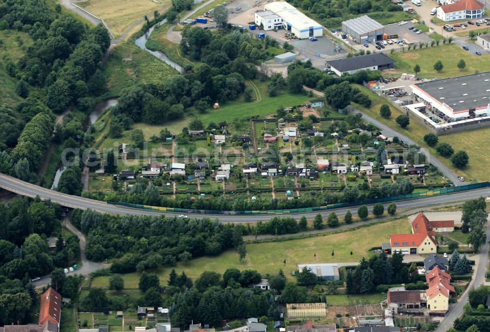 Nordhausen from above - The four-lane federal highway B4 crosses in the district Sundhausen of Nordhausen in Thuringia the river Helme. In direct proximity to the highway, there is a small garden area. In addition, the home improvement retailer Hellweg has a Filliale