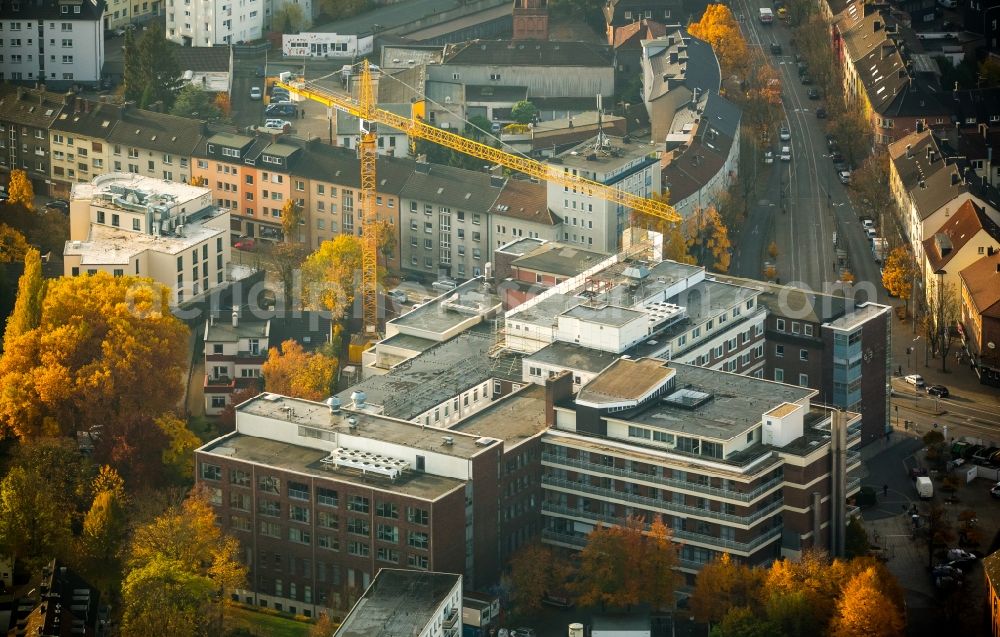 Aerial photograph Witten - Building of the Marien-Hospital in Witten in the state of North Rhine-Westphalia. A yellow crane is located next to the building