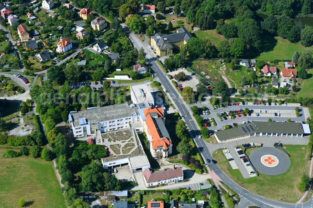 Radeberg from the bird's eye view: Hospital grounds of the Asklepios-ASB Hospital Radeberg GmbH on Pulsnitzer Strasse with the Radeberg rescue station on the opposite side and a helipad in the district Feldschloesschen in Radeberg in the state Saxony, Germany