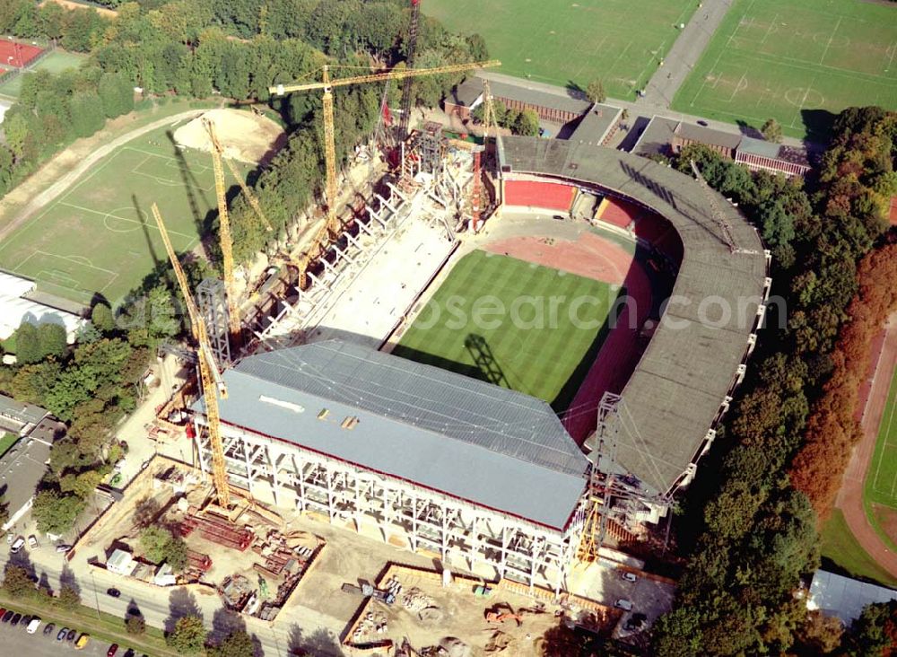 Aerial photograph Köln - Umbau des 1923 erbauten Müngersdorfer Stadion. Das neue Stadion wird 2003 fertiggestellt und bietet knapp 51.000 Zuschauer Platz. Architekt: Marg, Gerkan u. Partner, RheinEnergieStadion, Aachener Straße, 50933 Köln, Telefon: 02 21/4 98 36