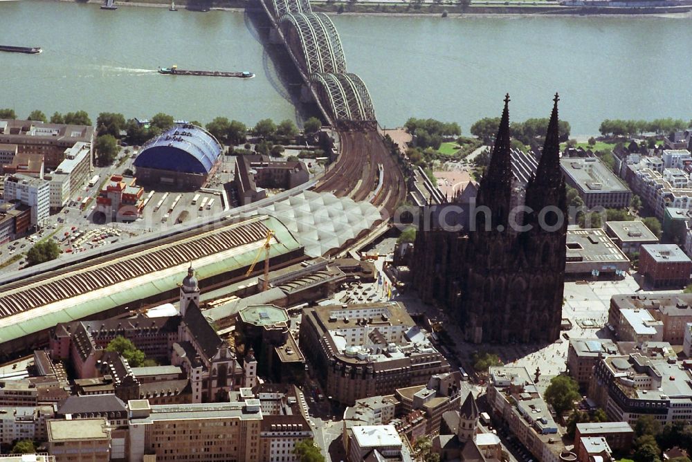 Köln from the bird's eye view: View of the Cologne Cathedral in the city center in the state North Rhine-Westphalia. The Cologne Cathedral is a Roman Catholic church build in the Gothic style and the Cathedral of the Archdiocese of Cologne. It is the second highest church building in Europe and the third highest in the world. Also visible are the central station and the bridge Hohenzollernbruecke over the river Rhine