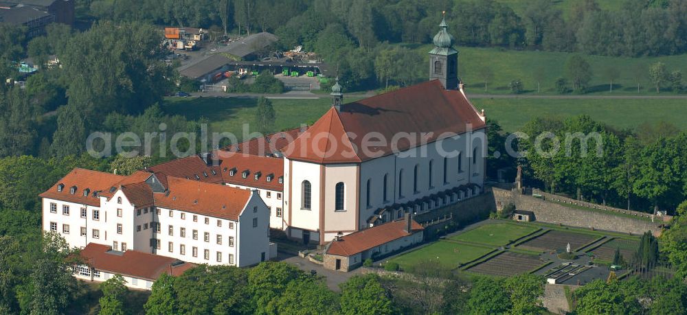 Aerial photograph Fulda - Blick auf das Kloster Freundenberg mit der barocken Klosterkirche. Das Kloster der Franziskaner steht auf dem gleichnamigen Berg und wurde schon im 9. Jahrhundert gegründet. View of the Monastery Freudenberg with the baroque monastery church. The Abbey was founded in the 9th Century.