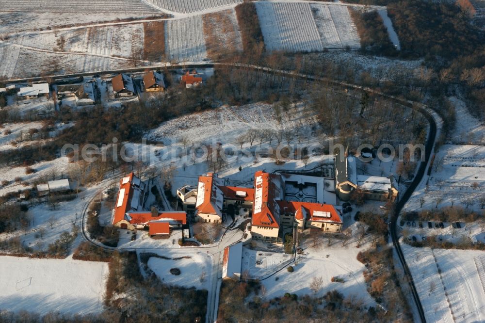 Aerial image Ockenheim - The secluded monastery Jakobsberg in winter. The building complex of the monastery is surrounded by snow-covered meadows and fields in Ockenheim in the state of Rhineland-Palatinate