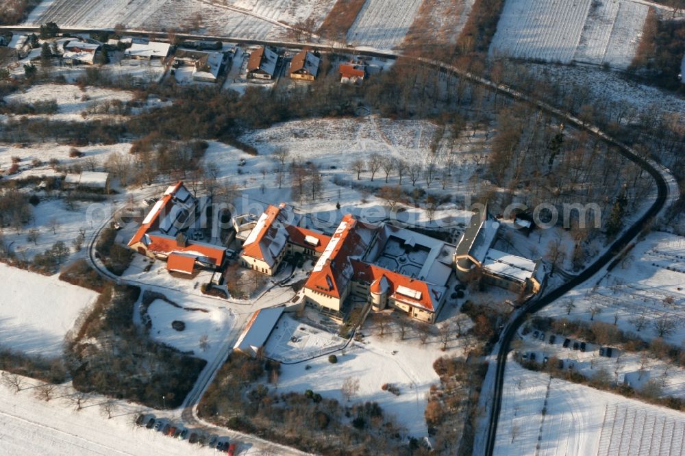 Aerial photograph Ockenheim - The secluded monastery Jakobsberg in winter. The building complex of the monastery is surrounded by snow-covered meadows and fields in Ockenheim in the state of Rhineland-Palatinate