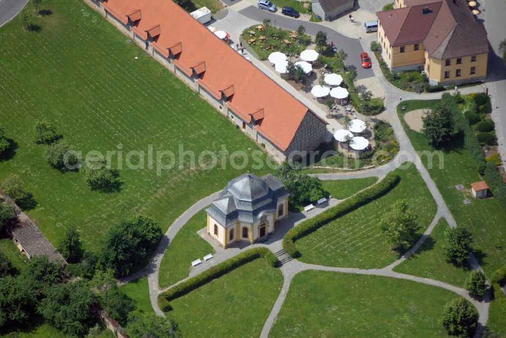 Münnerstadt from the bird's eye view: Blick auf das Gartensalett des Abtes Bonifaz Geßner im Kloster Maria Bildhausen. Das Gartensalett erbaut 1765/66 gehört zum Komplex des Klosters Maria Bildhausen. Das Kloster wurde 1158 durch Hermann von Stahleck, Pfalzgraf bei Rhein gegründet und von Mönchen aus dem Kloster Ebrach besiedelt. 1897 zogen Schwestern der St. Josefskongregation aus Ursberg ein und errichteten 1929 eine Behinderteneinrichtung. Diese wird seit 1996 von der kirchlichen Stiftung Dominikus-Ringeisen-Werk weitergeführt. Kontakt: Maria Bildhausen, 97702 Münnerstadt, Tel.: (09766) 94 00 5 - 0, Fax: (09766) 94 00 5 - 11, email: info@bildhausen.de