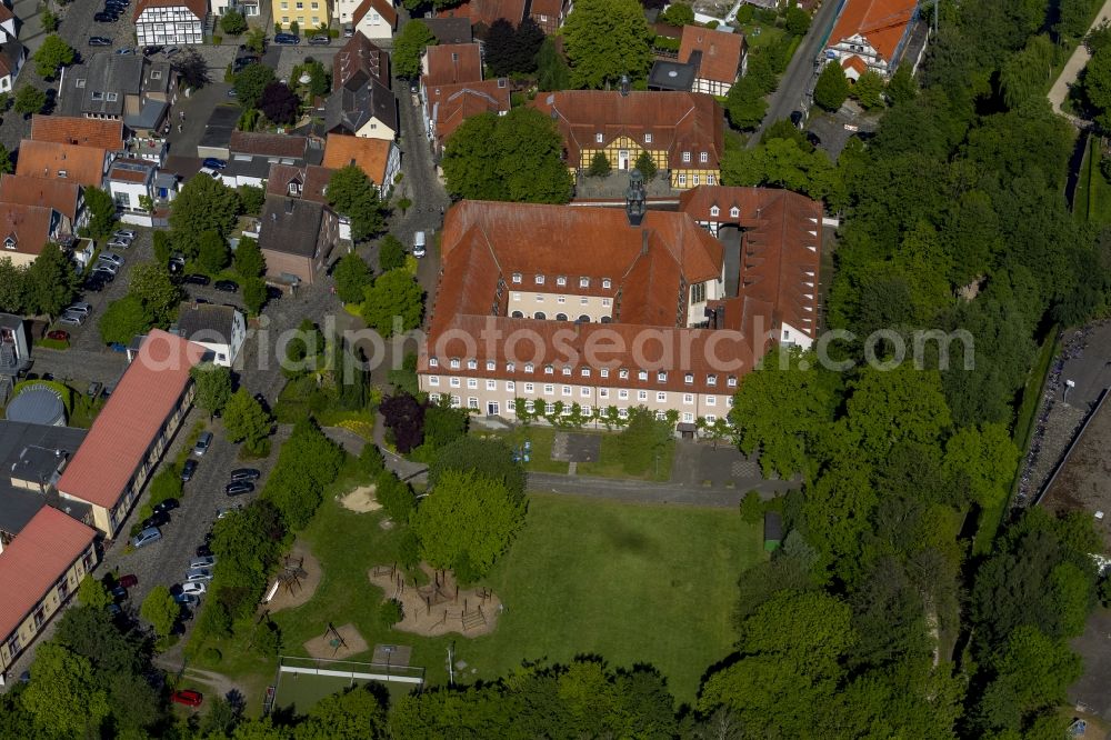 Aerial photograph Rietberg - The former Franciscan monastery on the Ems in Rietberg in the Klosterstrasse in the state North Rhine-Westphalia. Behind, the building of the old Progymnasium is located on the Emsstrasse. It's a half-timbered house