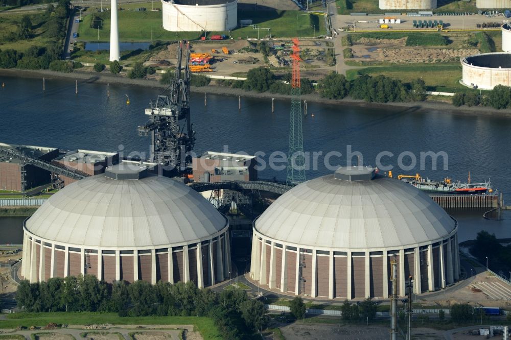 Hamburg from the bird's eye view: Coal power plants of the Vattenfall power plant Moorburg in Hamburg in Germany. The power plant with its domes, silos and technical facilities is located on the riverbank of the Suederelbe