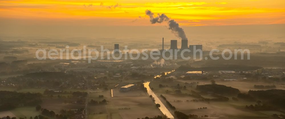 Hamm from the bird's eye view: Coal-fired power plant Westphalia in the sunrise with smoke and cooling towers in Hamm, North Rhine-Westphalia, Germany