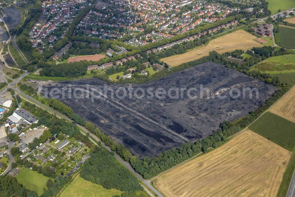 Kamp-Lintfort from the bird's eye view: Coal storage yard in Kamp-Lintfort on the Norddeutschlandstrasse in the state North Rhine-Westphalia