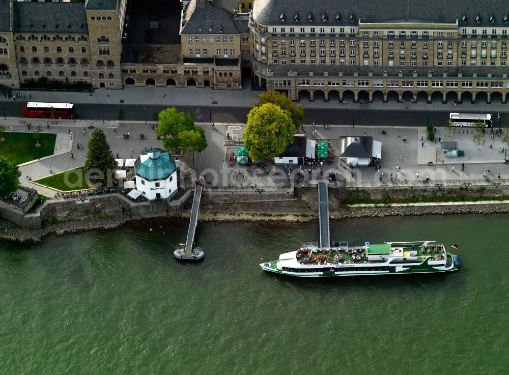 Koblenz from the bird's eye view: Konrad-Adenauer-Ufer, Pegelhaus and ships dock in Koblenz in the state Rhineland-Palatinate. The former crane Pegelhaus is used as a restaurant today. A shipping dock for Rhine ships is located adjacent to it