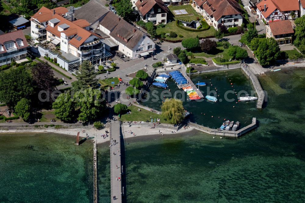 Aerial image Hagnau am Bodensee - Running surfaces and construction of the pier over the water surface . in Hagnau am Bodensee in the state Baden-Wuerttemberg, Germany