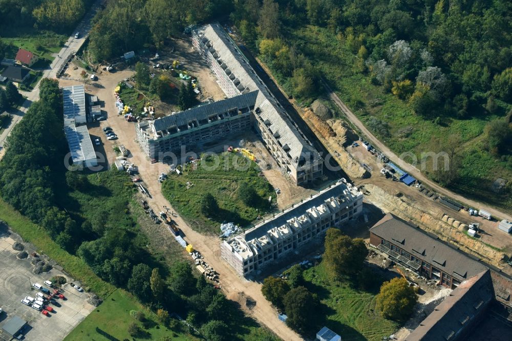 Bernau from the bird's eye view: Construction site for the renovation and reconstruction of the building complex of the former military barracks Sanierungsgebiet Panke-Park on Schoenfelder Weg in Bernau in the state Brandenburg, Germany