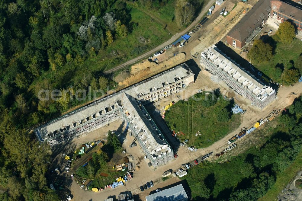 Bernau from the bird's eye view: Construction site for the renovation and reconstruction of the building complex of the former military barracks Sanierungsgebiet Panke-Park on Schoenfelder Weg in Bernau in the state Brandenburg, Germany