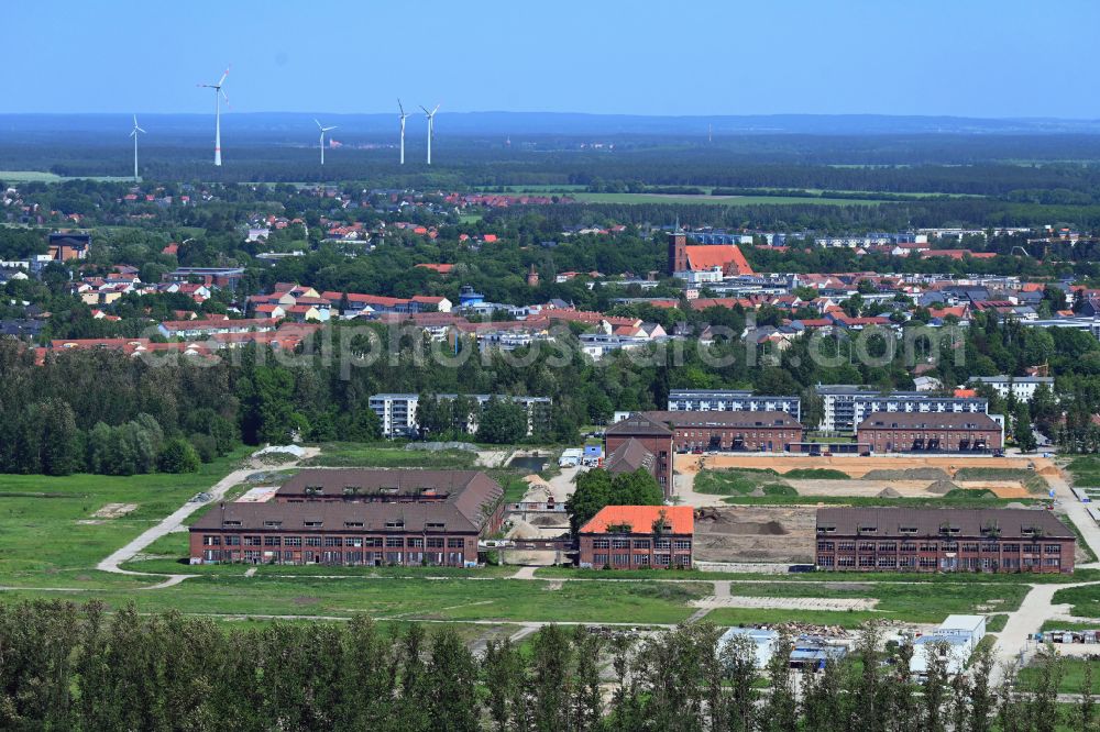 Bernau from the bird's eye view: Construction site for the renovation and reconstruction of the building complex of the former military barracks on Schwanbecker Chaussee in the district Lindow in Bernau in the state Brandenburg, Germany