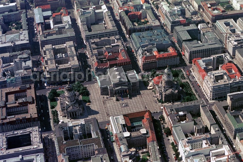 Berlin from the bird's eye view: The Gendarmenmarkt in Berlin-Mitte is one of the most beautiful places in Germany. The historical building ensemble with the Konzerthaus, the French cathedral, the German Cathedral and the French Friedrichstadt Church is one of the Top sights of the capital. Architects such as Carl von Gontard, Carl Gotthard Langhans and Karl Friedrich Schinkel have left here with their designs tracks. The surrounding neighborhoods are in the so-called Friedrichstadt Prussian arrangement like on a drawing board. Is the Galeries Lafayette Berlin at the near Friedrichstraße