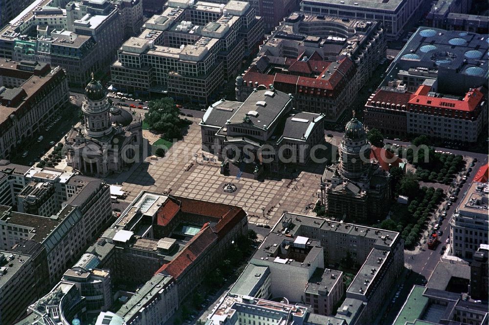 Aerial image Berlin - The Gendarmenmarkt in Berlin-Mitte is one of the most beautiful places in Germany. The historical building ensemble with the Konzerthaus, the French cathedral, the German Cathedral and the French Friedrichstadt Church is one of the Top sights of the capital. Architects such as Carl von Gontard, Carl Gotthard Langhans and Karl Friedrich Schinkel have left here with their designs tracks. The surrounding neighborhoods are in the so-called Friedrichstadt Prussian arrangement like on a drawing board. Is the Galeries Lafayette Berlin at the near Friedrichstraße