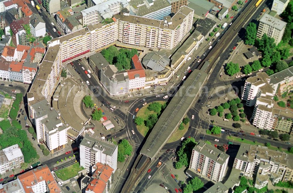 Aerial photograph Berlin - View of the Kottbusser Platz square with the same name mentioned metro nodes in Berlin-Kreuzberg. The Kotti has been known since the construction of the Neuen Kreuzberger Zentrum as a social focal point