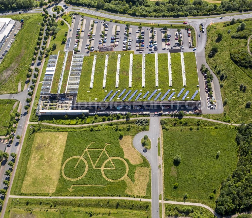 Aerial image Hamm - Eco-Center Hamm with a big bike in a meadow behind the OBI store in Hamm in North Rhine-Westphalia