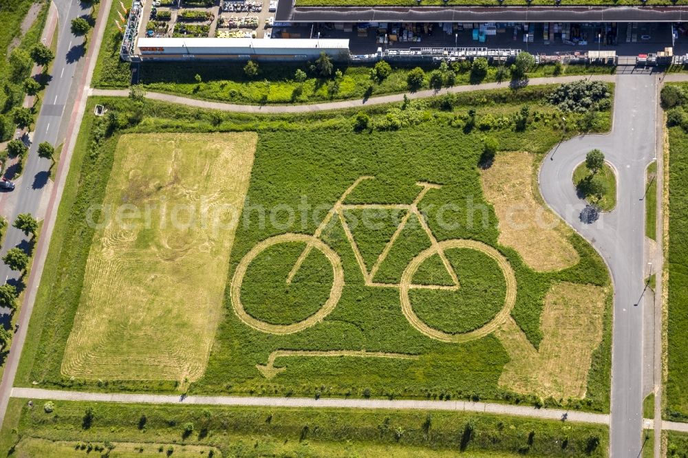 Aerial photograph Hamm - Eco-Center Hamm with a big bike in a meadow behind the OBI store in Hamm in North Rhine-Westphalia