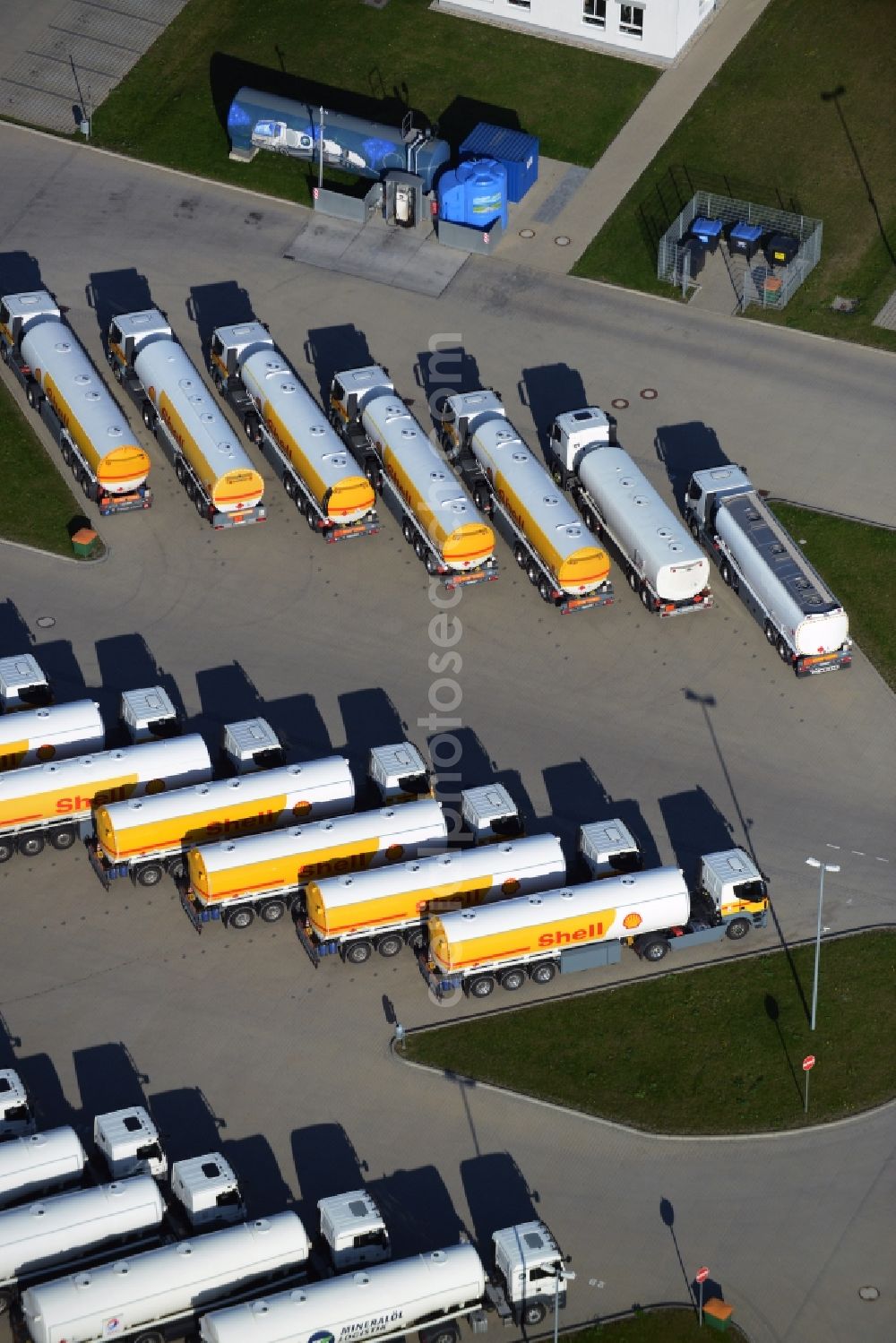 Aerial image Seefeld - Automotive parking- space with rows of parked truck tankers in Seefeld in Brandenburg