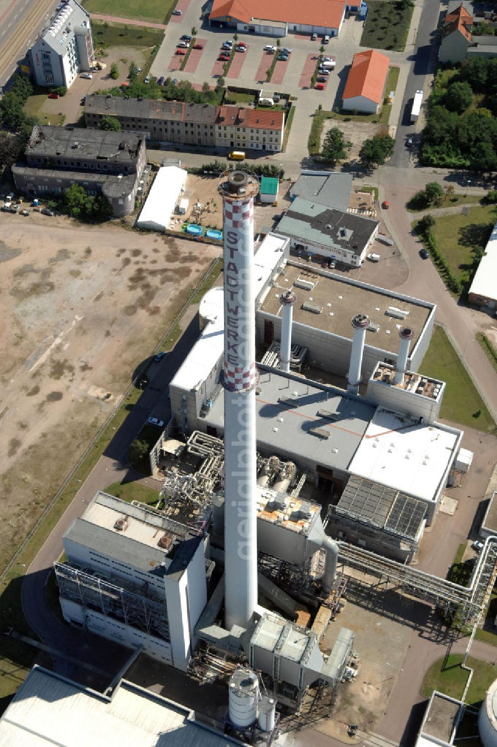 Aerial photograph Dessau-Roßlau - Blick auf das Kraftwerk Dessau An der Fine 4 in der Nähe vom Gewerbepark Dessau-Mitte. Betreiber ist die Kraftwerk Dessau GmbH. Das Kraftwerk wurde 1996 fertiggestellt und versorgt Dessau mit Wärme und Strom (durch eine Gas- und Dampfturbinenanlage). Kontakt Dessauer Versorgungs- und Verkehrsgesellschaft mbH: Tel. +49(0)340 8990, Email: stadtwerke@dvv-dessau.de